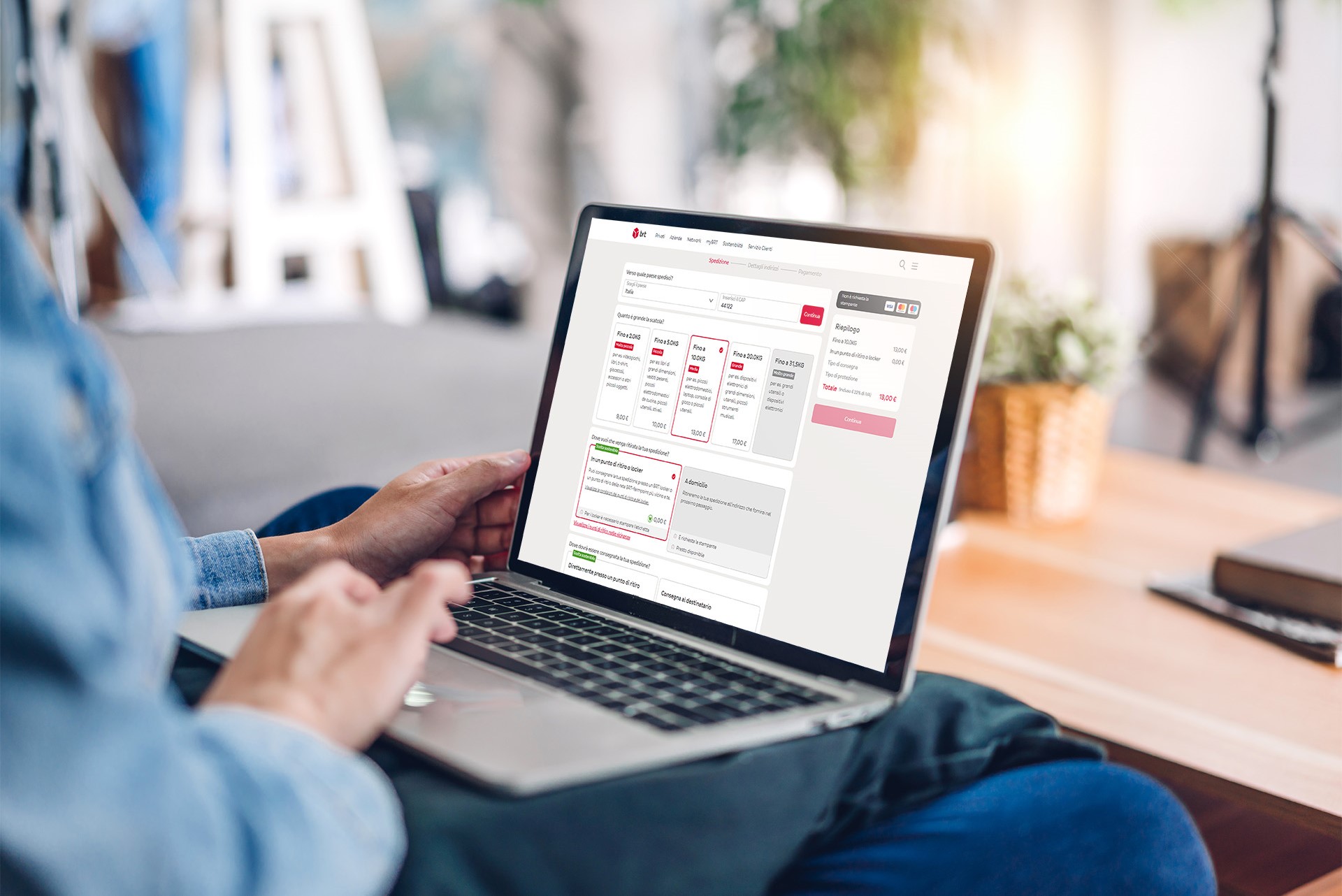 man with laptop buying a shipment online