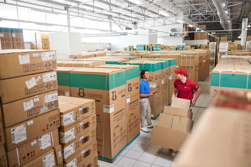 Driver delivering parcels in electronics warehouse