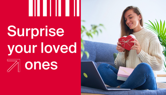 Surprise your loved ones – girl on the sofa with a laptop and a box ready to be shipped