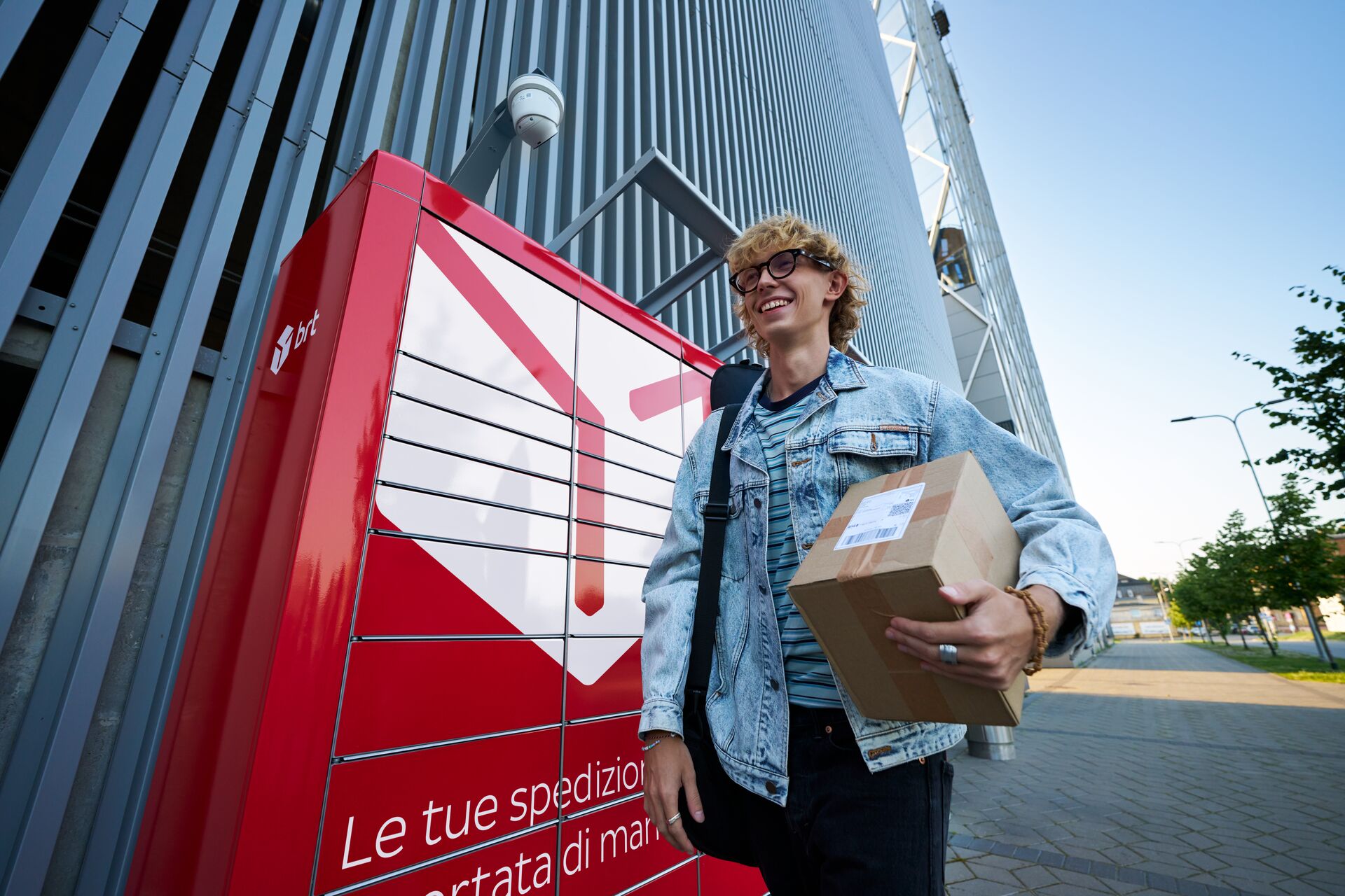 Young man picking up a parcel